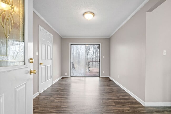 Building Photo - Lovely home on beautiful, wooded corner - Just Reduced