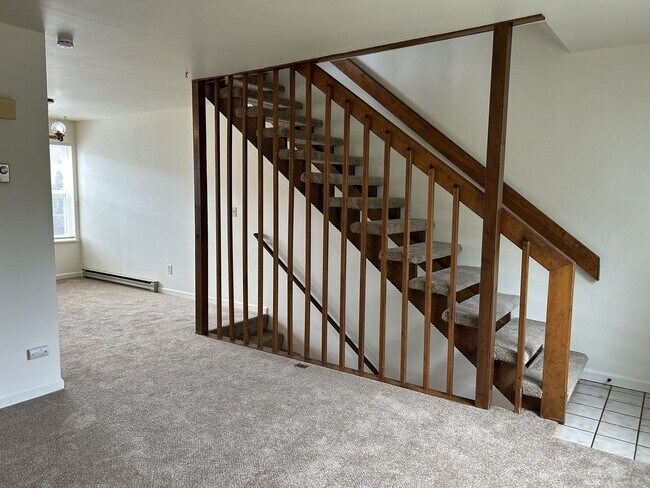 Building Photo - Quiet and Sunlit Townhome with Attached Garage and Washer/Dryer Included