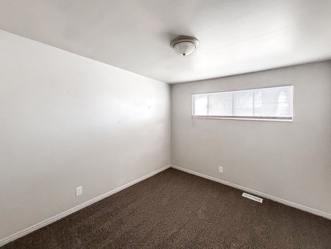 Building Photo - Spacious 5-Bedroom Home with Lofted Garage