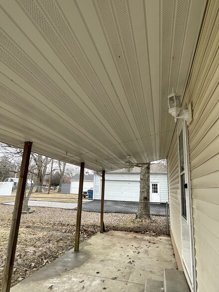 Covered patio with new fan and light - 303 E 4th St