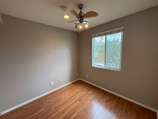 Building Photo - Sleek 2-Bed with a Den/Office + Flex Corner Condo with Attached Tandem Garage