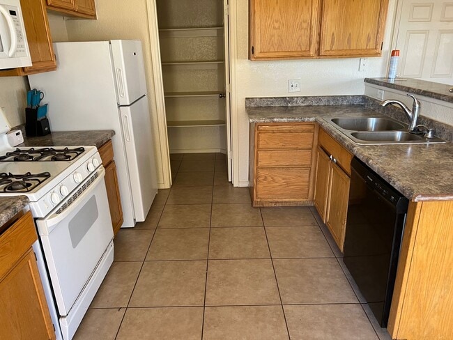 Building Photo - Four Bedroom Mountain View Home with large fenced back yard and double gates