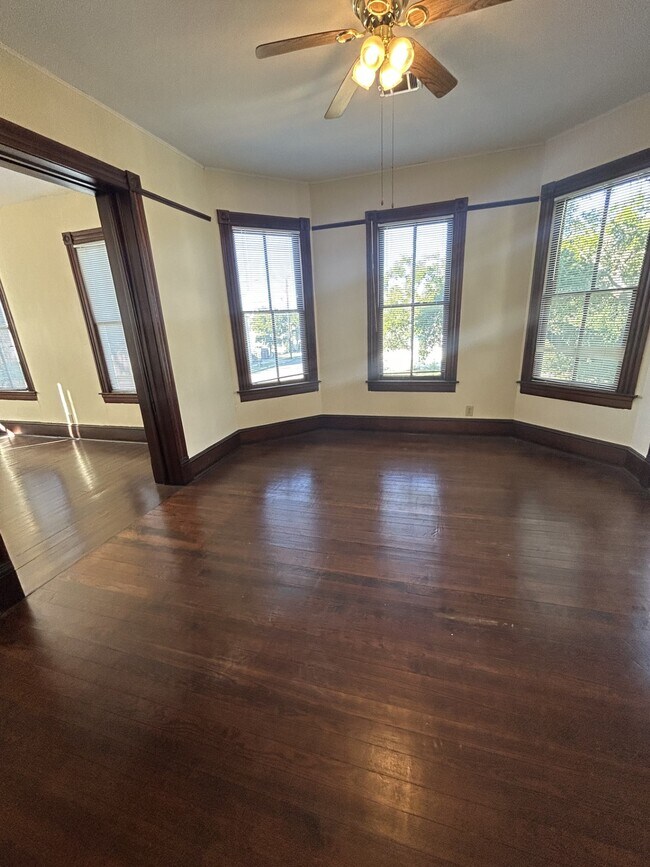 Formal dining room with living room through the pocket doors on the left. - 1118 25th St