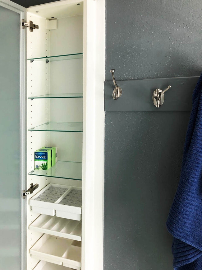 Extra bathroom storage built into wall - 1602 Valleyridge Dr