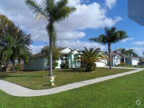 Building Photo - 4 BEDROOM - GATED TWIN LAKES SUBDIVISION -...