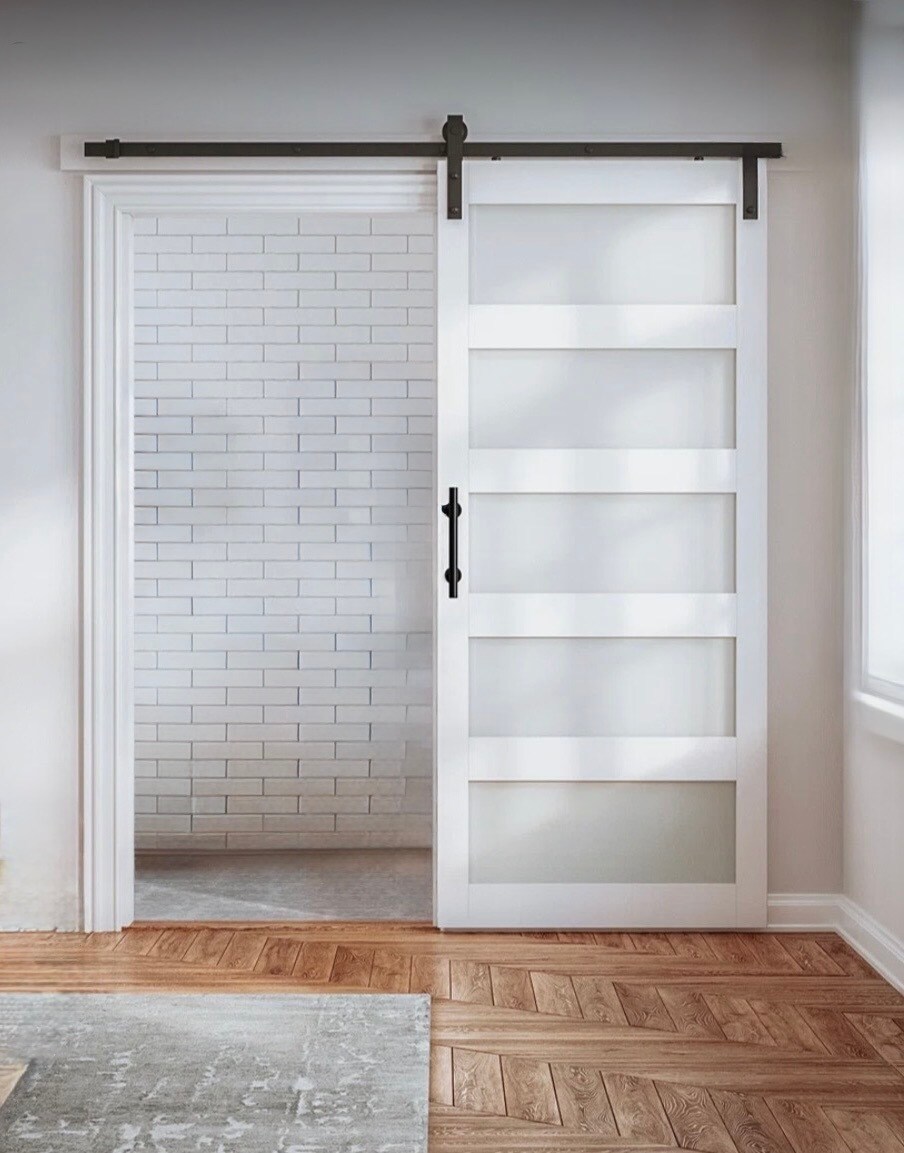 Barn door added to entrance into living room. - 771 56th St