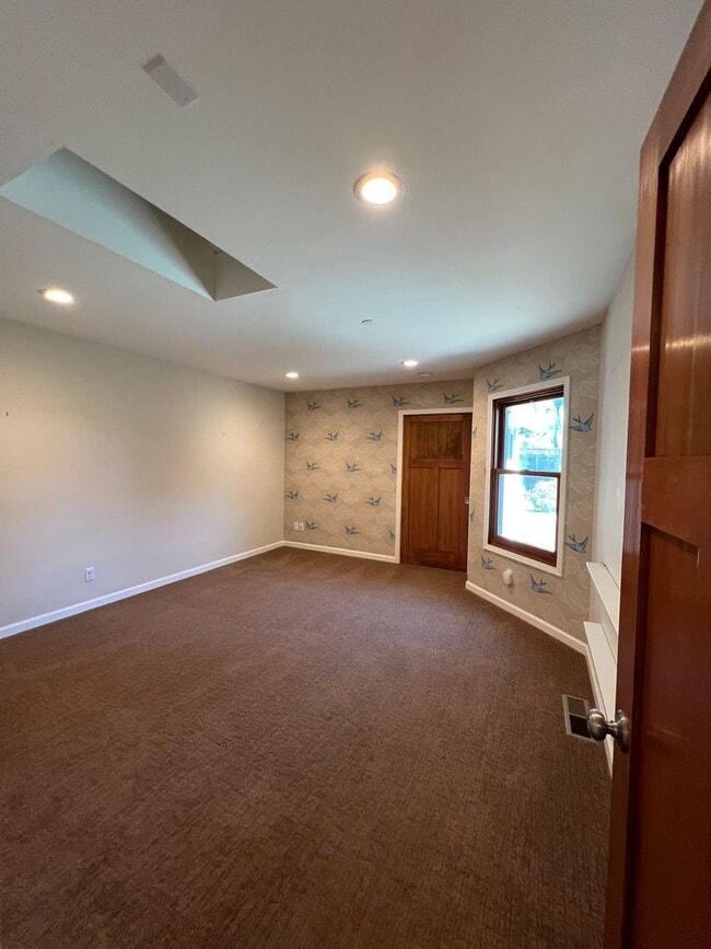 Building Photo - Spacious 4-Bedroom Retreat Just Steps from...