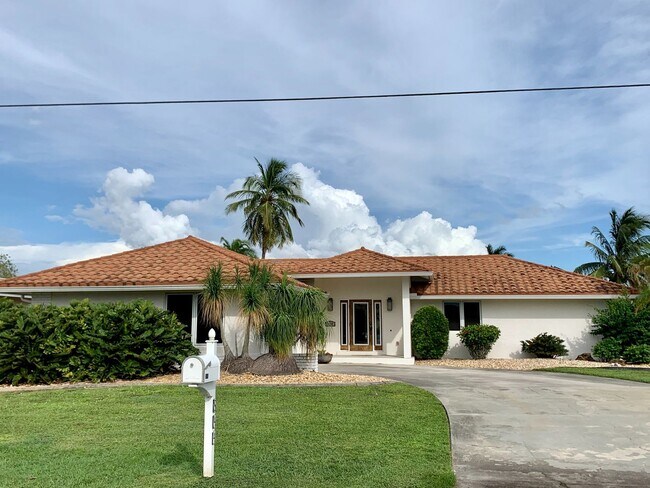 Building Photo - AVAILABLE 2027 SEASON! ! PGI HEATED POOL, WATERFRONT, BOAT LIFT