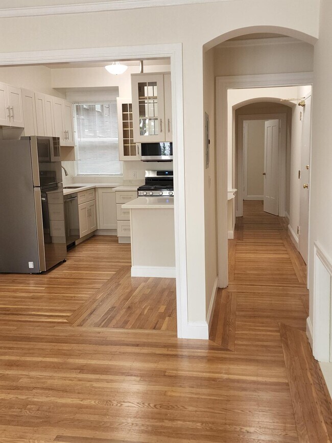 Looking from living room to dining area and kitchen and hallway to right to entry door, bath & bedrm - 3119 Jackson St