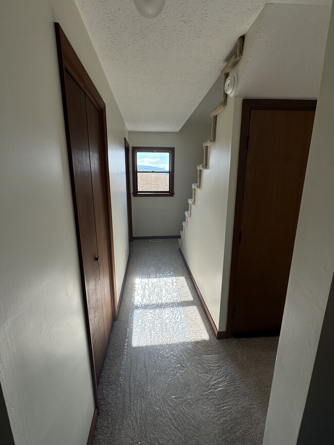 Hallway to laundry room/bathroom - 124 Harrington Hollow Rd