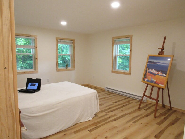 The bedroom further from your deck has quiet woodland views on both sides - 57 River Rd