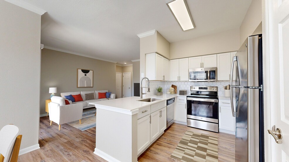 Newly Renovated Kitchen with Quartz Countertops - The Oasis Apartments