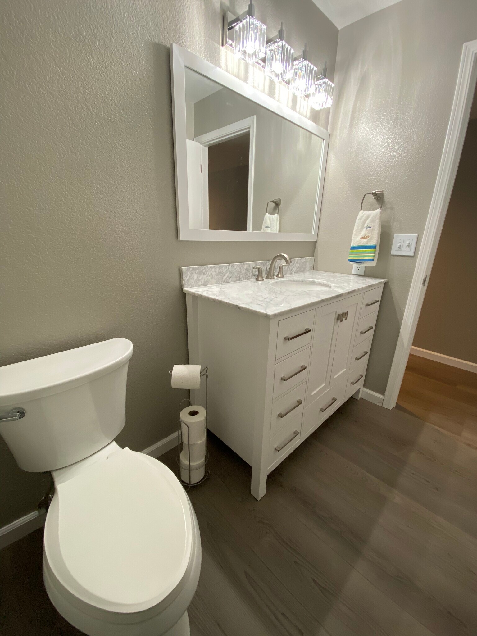 Another angle showing first floor bath vanity, mirror and lighting - 443 Willow Ave