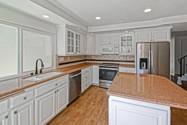 Building Photo - Bright & Spacious, 4BR3BA Home in the Private, Gated Community w/ 2 Pools, Clubhouse, Playground ...