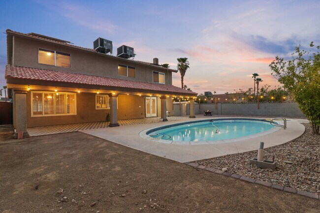 Building Photo - Welcome to your entertainers dream home with solar and pool service included!