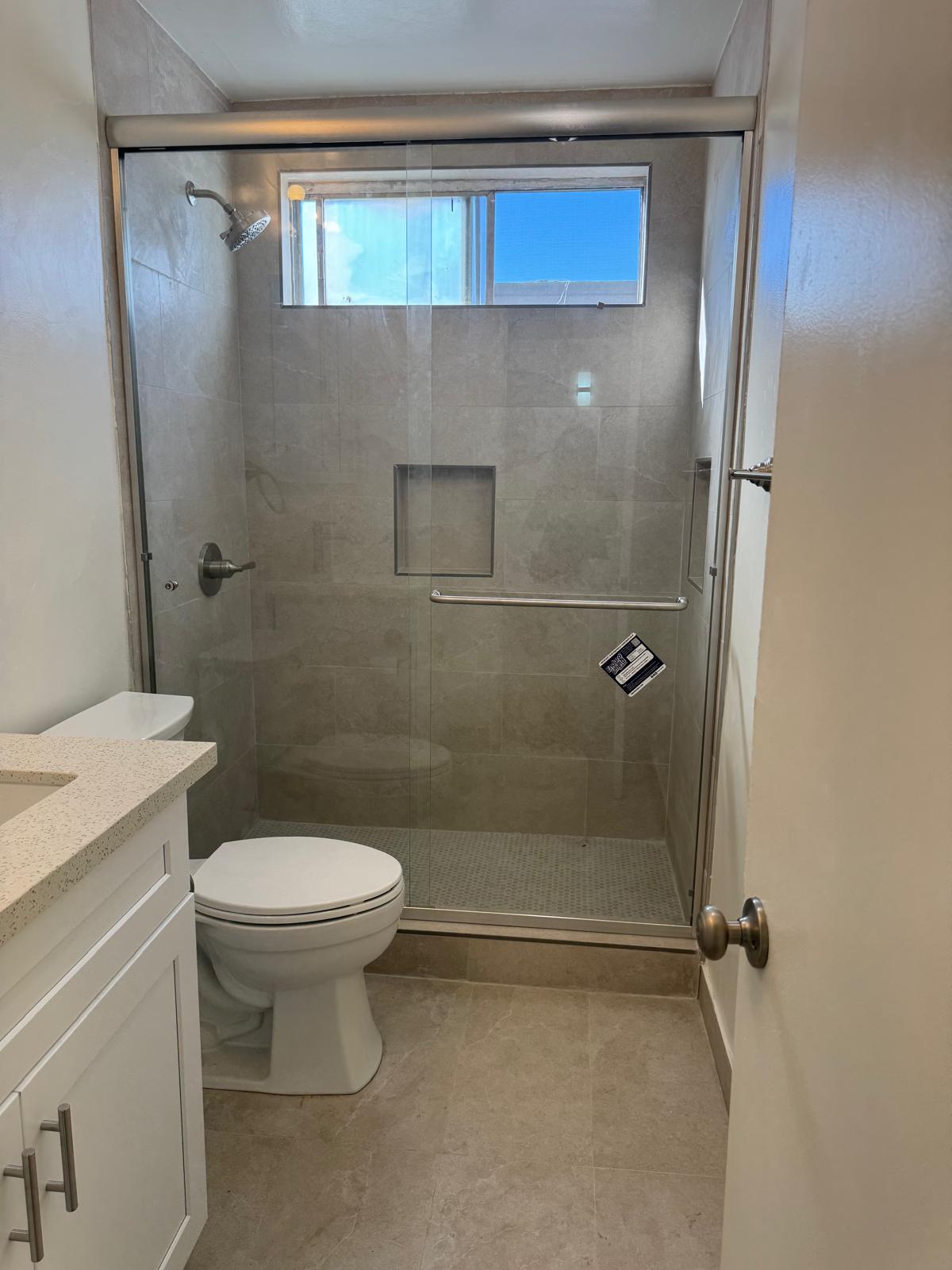 Bathroom with glass shower door - 13401 Victory Blvd