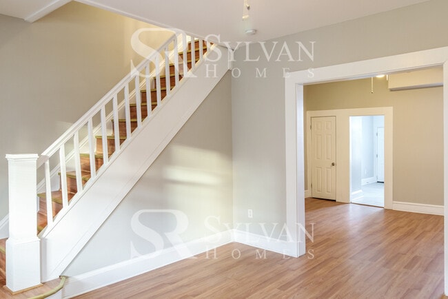 Building Photo - Welcome to this charming abode.