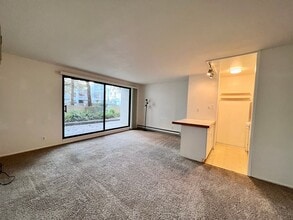 Building Photo - Cozy 1 bedroom on lush courtyard includes water / garbage & 1 parking spot.