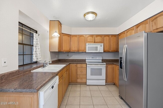 Building Photo - 5704 E Aire Libre Ave
