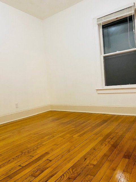Queen size bedroom with closet and view of backyard - 126 Peck Ave