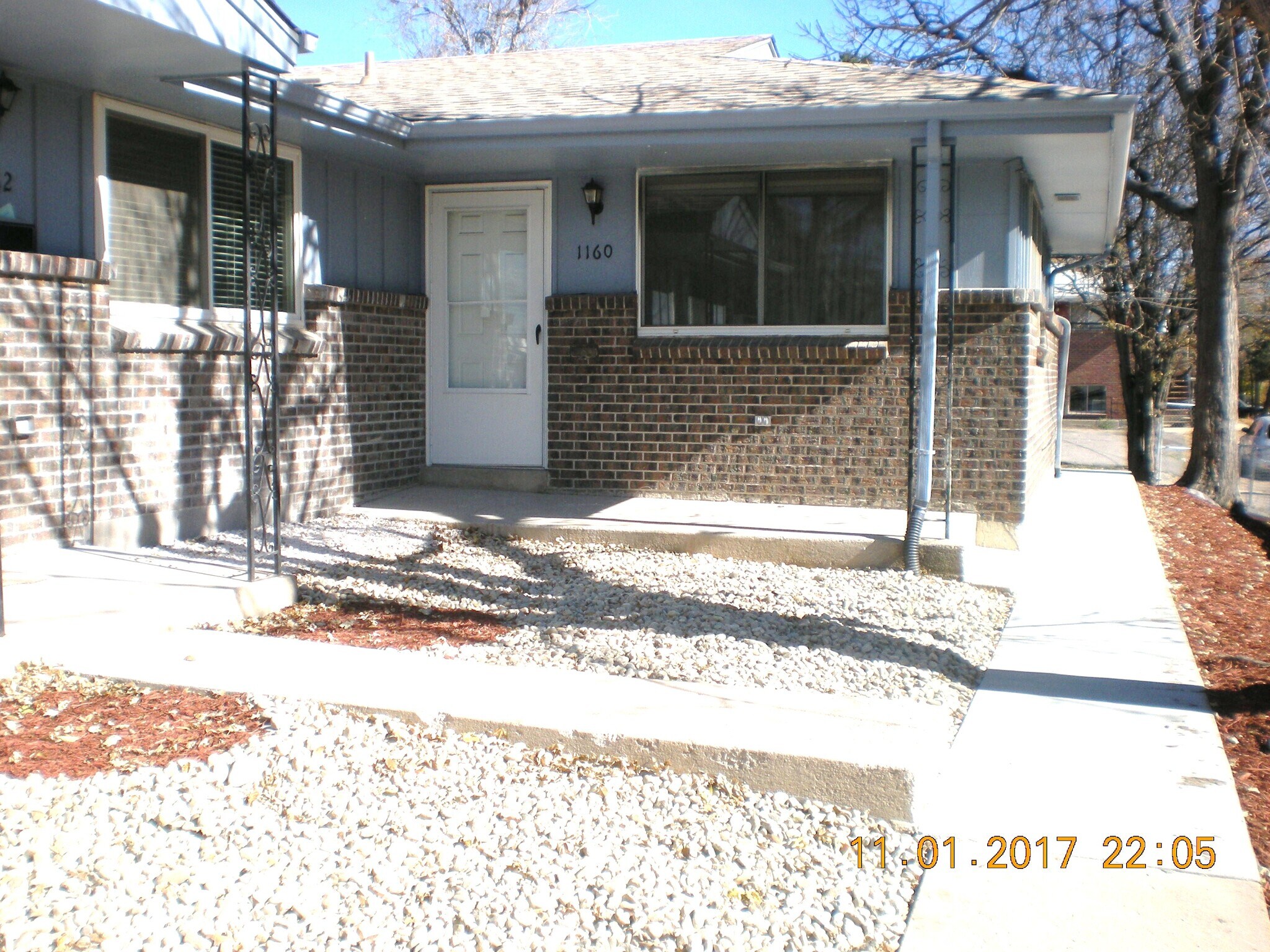 Exterior of 1160 Clinton with Xeriscape yard, no water or mowing! - 1160 Clinton St