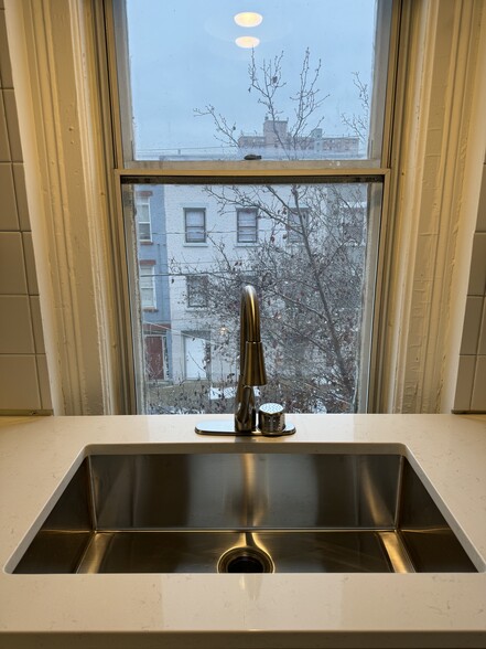 New farm sink and faucets make a great functional cook space - 118 Philip St