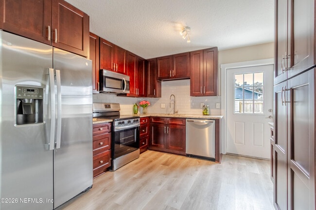 Building Photo - 10036 Delano Dr N