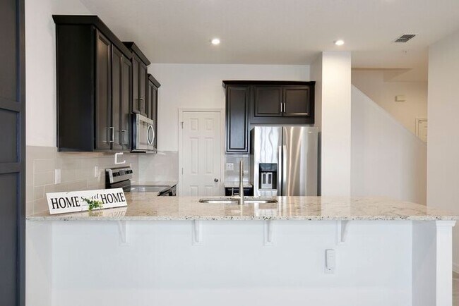 Building Photo - Luxurious 3/2.5 Modern Townhome with a Private Balcony and a 2 Car Garage in the Exclusive Gated ...