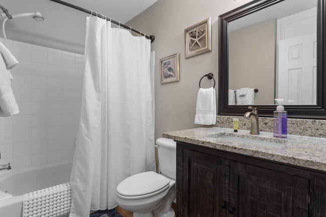 Building Photo - Welcome to Coastal Living at Harbor Landing Condominiums!