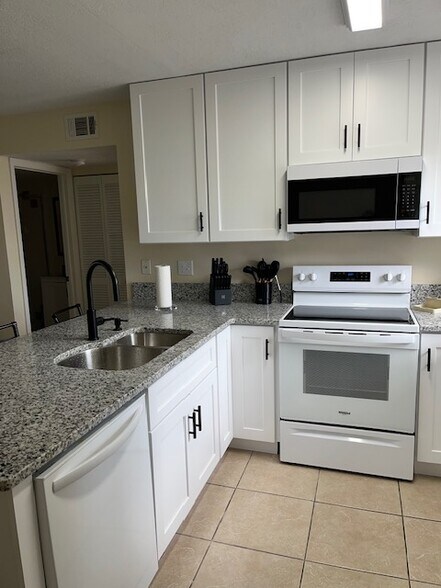 remodeled kitchen - 26485 Rampart Blvd