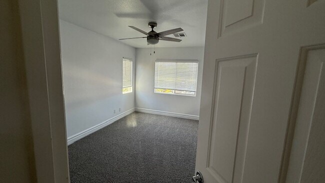 Building Photo - STUNNING 2 STORY HOME IN A GUARD GATED COM...