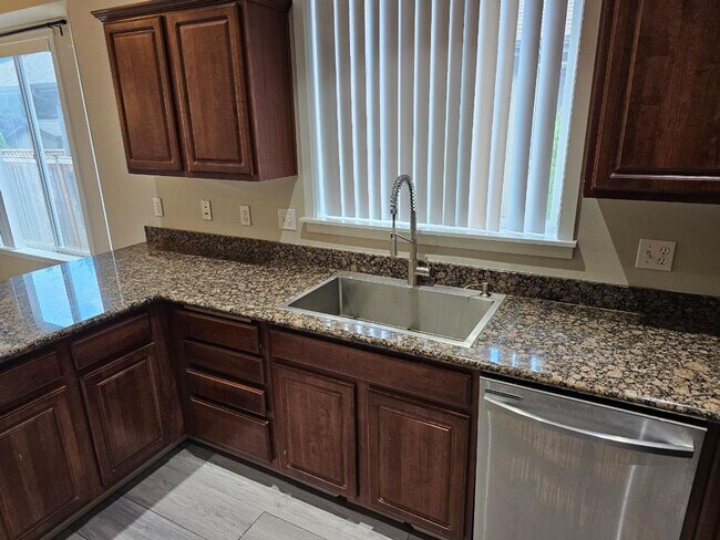 Building Photo - Spacious Tacoma Home with Gas Fireplace, 3-Car Garage & Covered Patio!