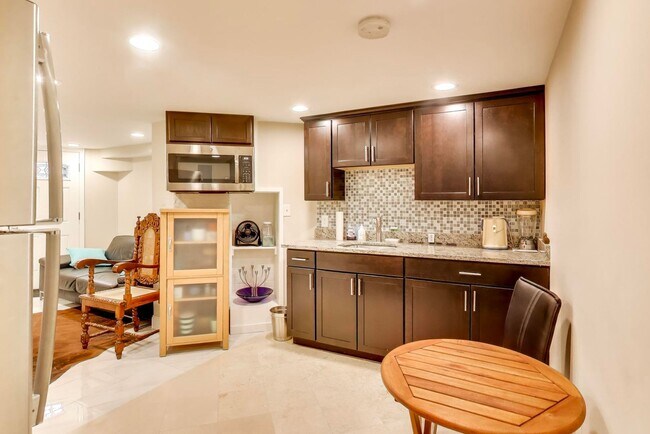 Building Photo - COMING SOON - Sprawling 5 Bed, 3 Bath, Two Kitchens, Dual Back Decks, Two Office/Den Townhouse, 2...