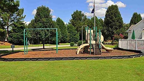 Building Photo - Like New 3 Bedroom & 2 Bath pond front home in Hillsborough! Enjoy the Community Pool, Playground...