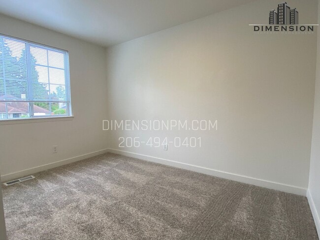 Building Photo - Stylishly Renovated Home with Private Back...