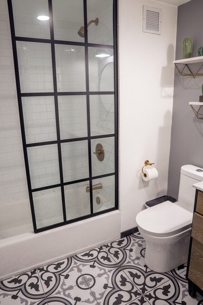 Bathroom echos renovated factory with industrial touches. - 25 N Broadway