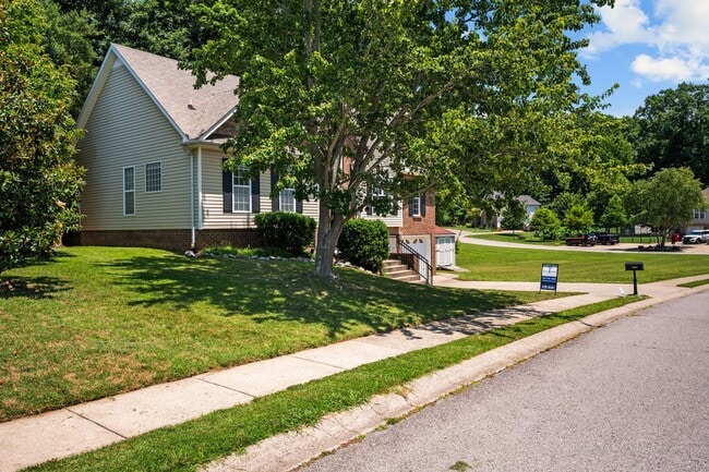 Building Photo - Stunning Stone Fireplace • Finished Basement • Fenced Yard