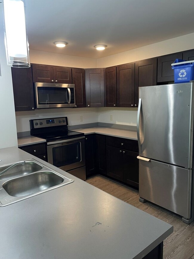 Building Photo - One Bedroom End Unit