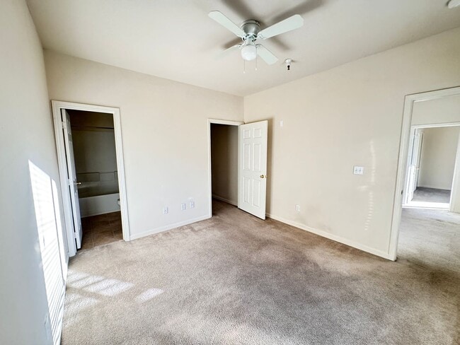 Building Photo - Home Near UNR: Spacious 4BR/4BA with Gated Access and Balcony!