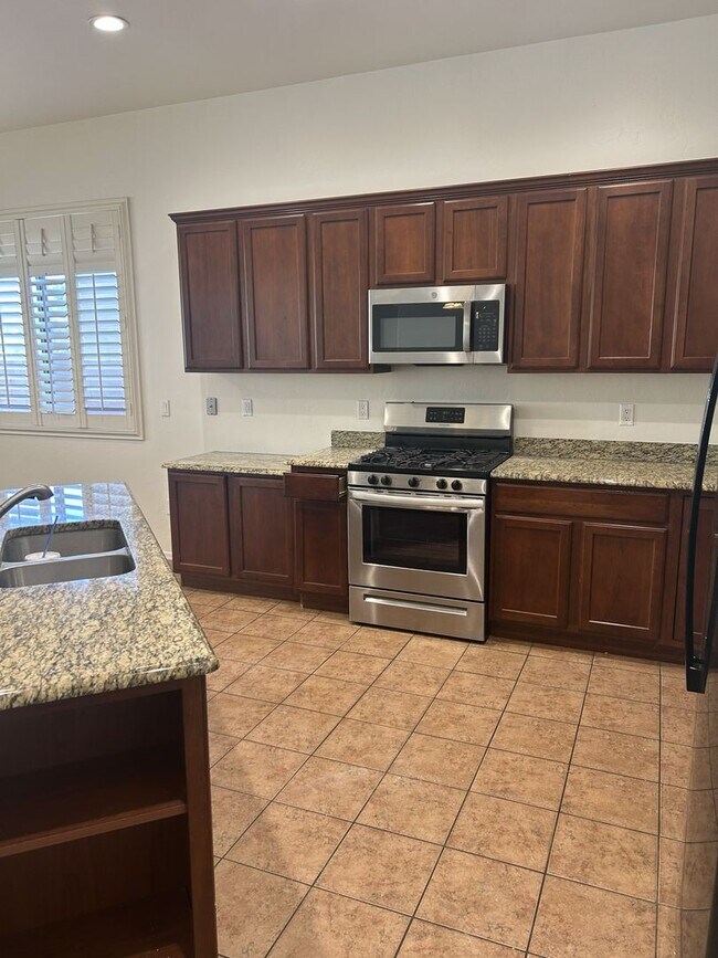 Building Photo - Unfurnished four bedroom large home!  Three car garage