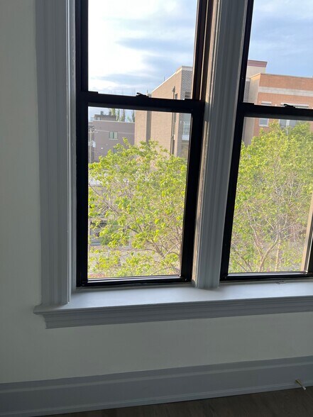 Large windows (throughout unit). - 2057 W Chicago Ave