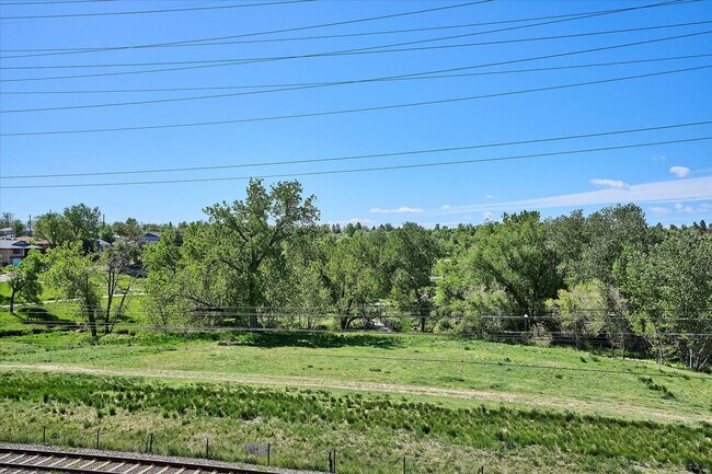 Building Photo - Modern 4-Bedroom Townhome with Rooftop Deck Near Sloan’s Lake & Light Rail