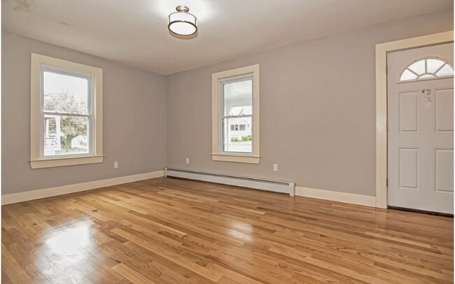 Living room & front entry door - 237 Standish Ave