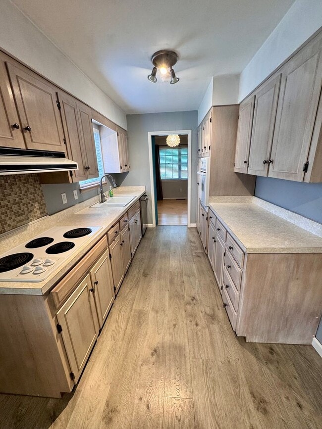 Building Photo - Beautiful corner lot. This home is very sp...