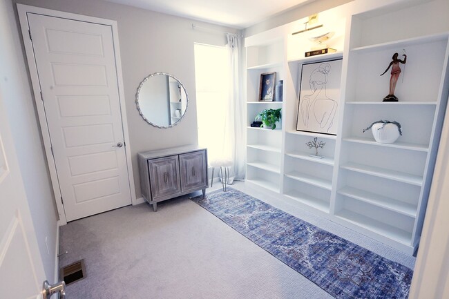 Guest bedroom #2 with custom bookcase (can be removed if space needed for bed). - 15637 E Broncos Pl