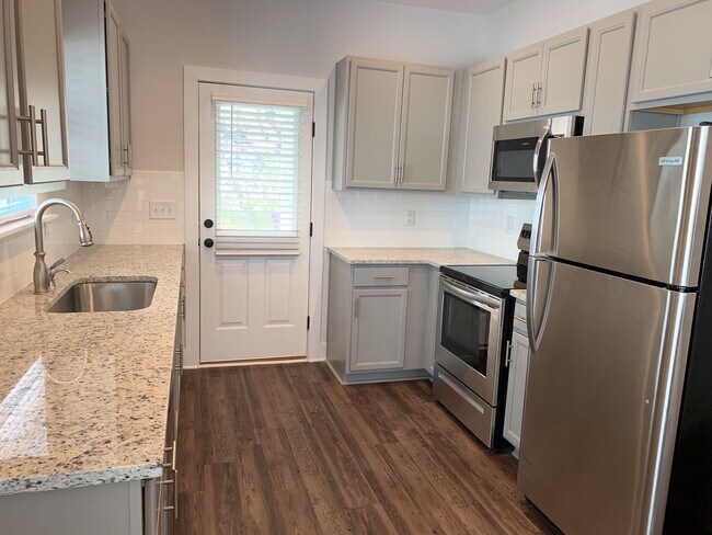 Building Photo - One level home with fenced backyard.