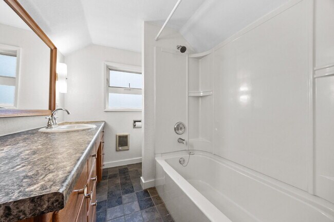 Building Photo - Adorable upper-floor APARTMENT One Bedroom. Washer/Dryer, Driveway parking for up to 3 vehicles. ...