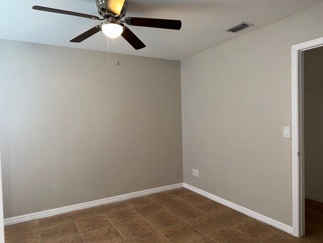 Building Photo - Experience this Cape Coral 3 bedroom 2 bath corner duplex with 1 car garage and screened in lanai.