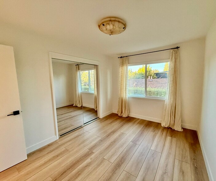 Bedroom 2 with vintage onyx light fixtures - 496 Sherwood Way
