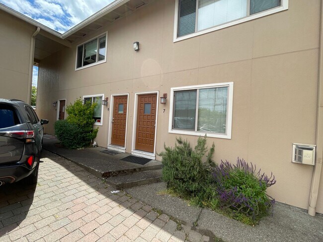 Building Photo - Stylish Corner Condo In Prime Location w/ Parking, Private Outdoor Space & W/D